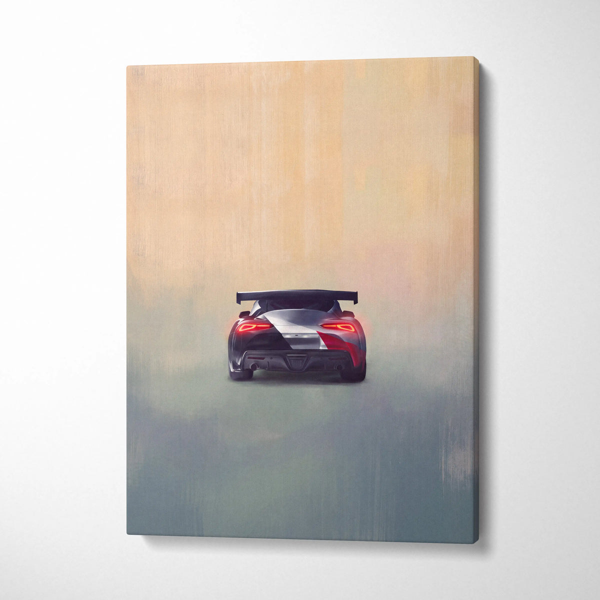 A canvas print of a red and silver Toyota GR Supra inspired sports car with black spoiler for garage wall decor