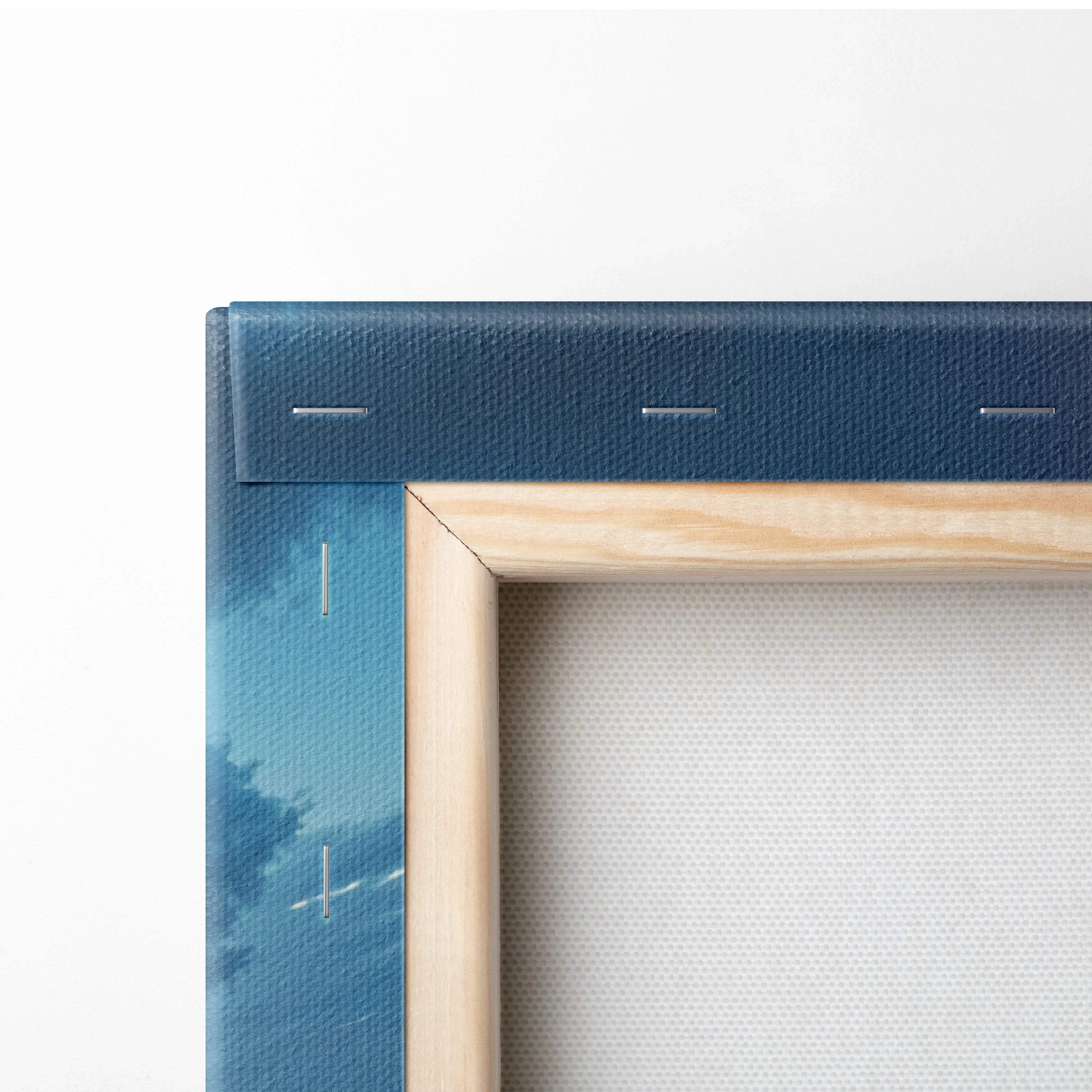 Visionary coastal sunset canvas art in blue tones with light wood frame