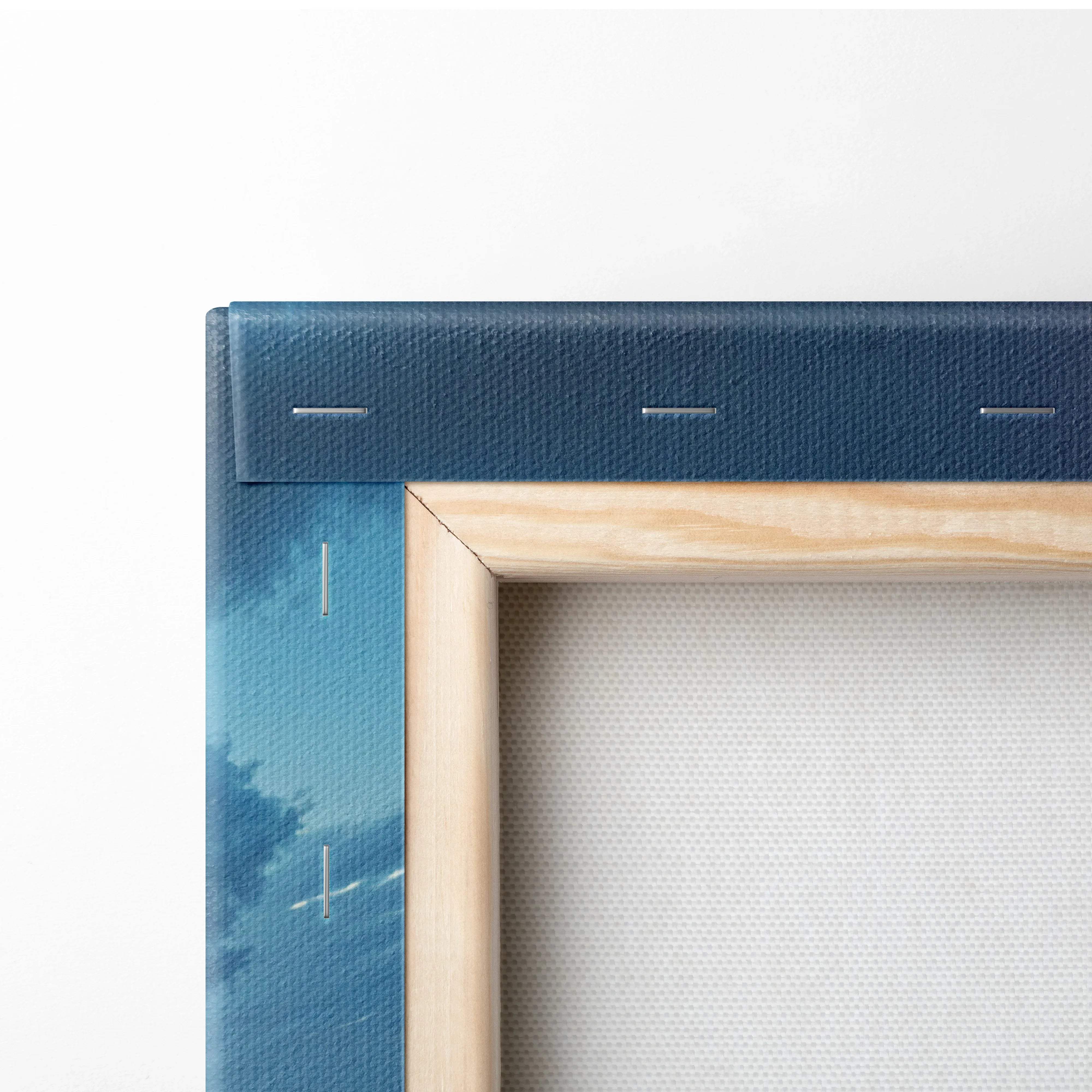 Visionary coastal sunset canvas art in blue tones with light wood frame