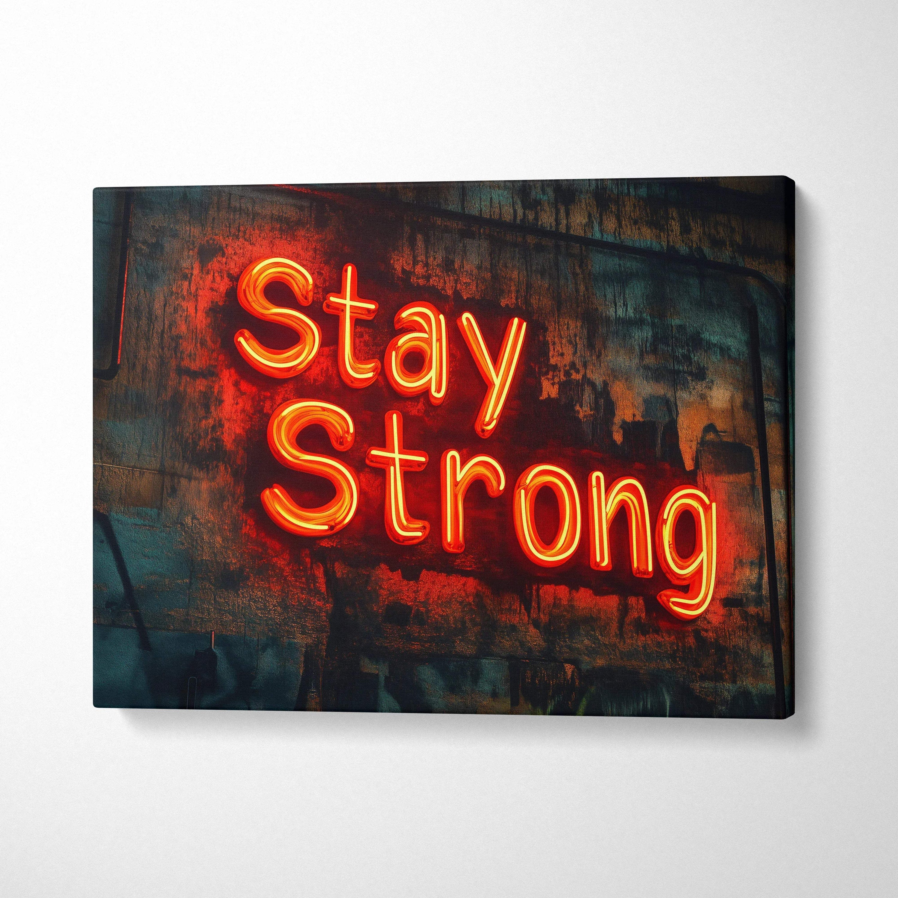 Vibrant orange neon Stay Strong sign on distressed canvas wall
