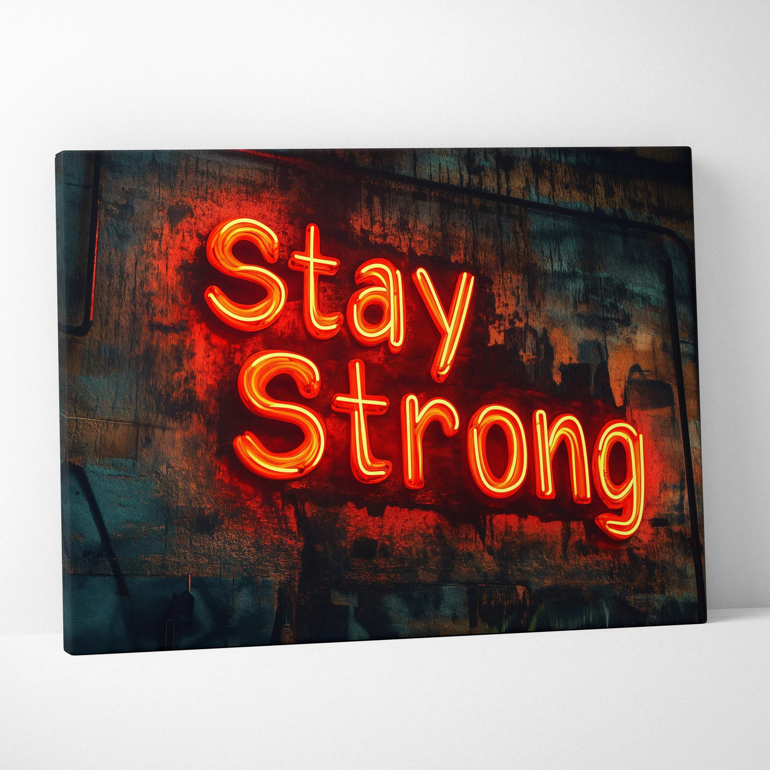 Vibrant orange neon Stay Strong sign on distressed textured wall