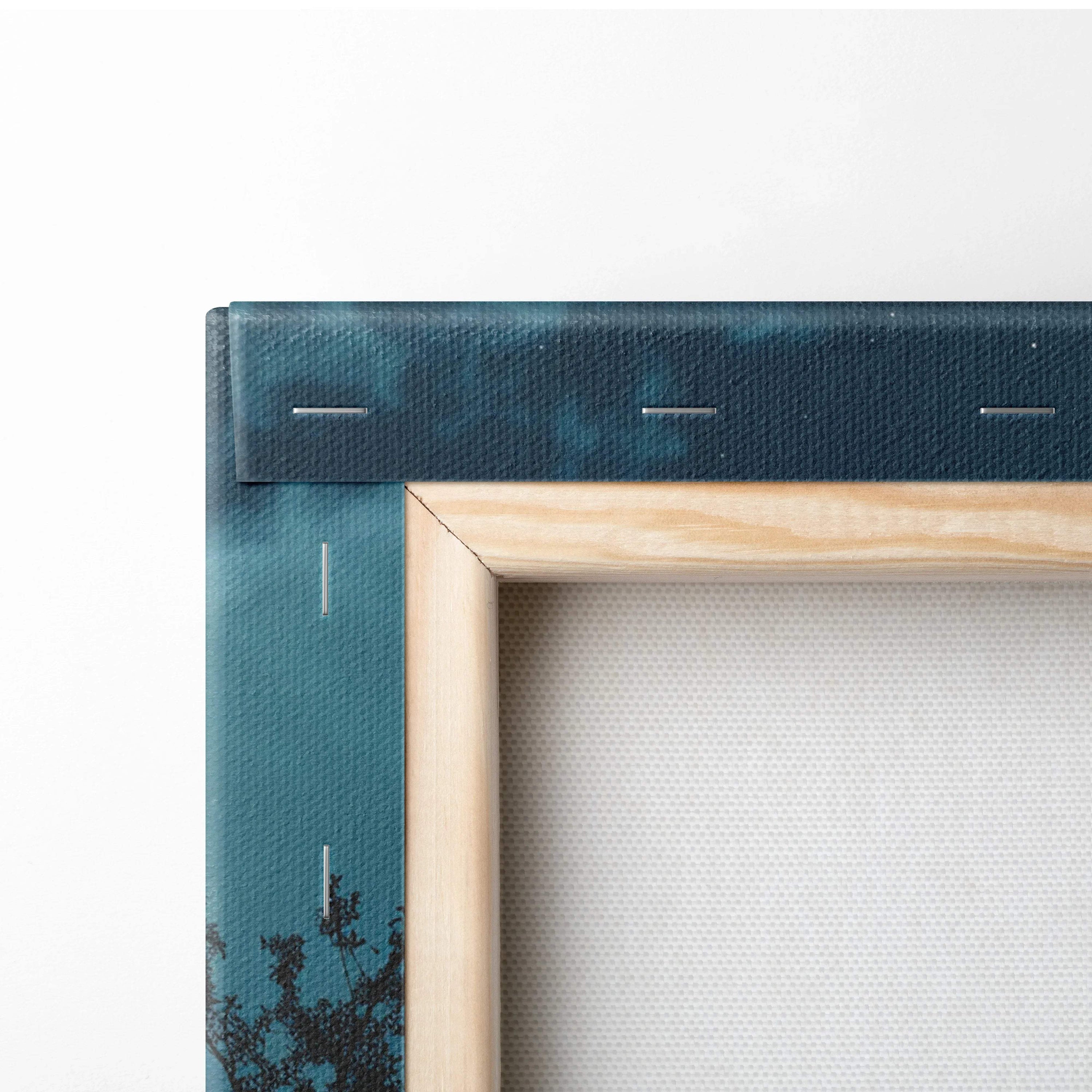 Back of Moonlit Stillwater teal canvas wall art on light wood frame