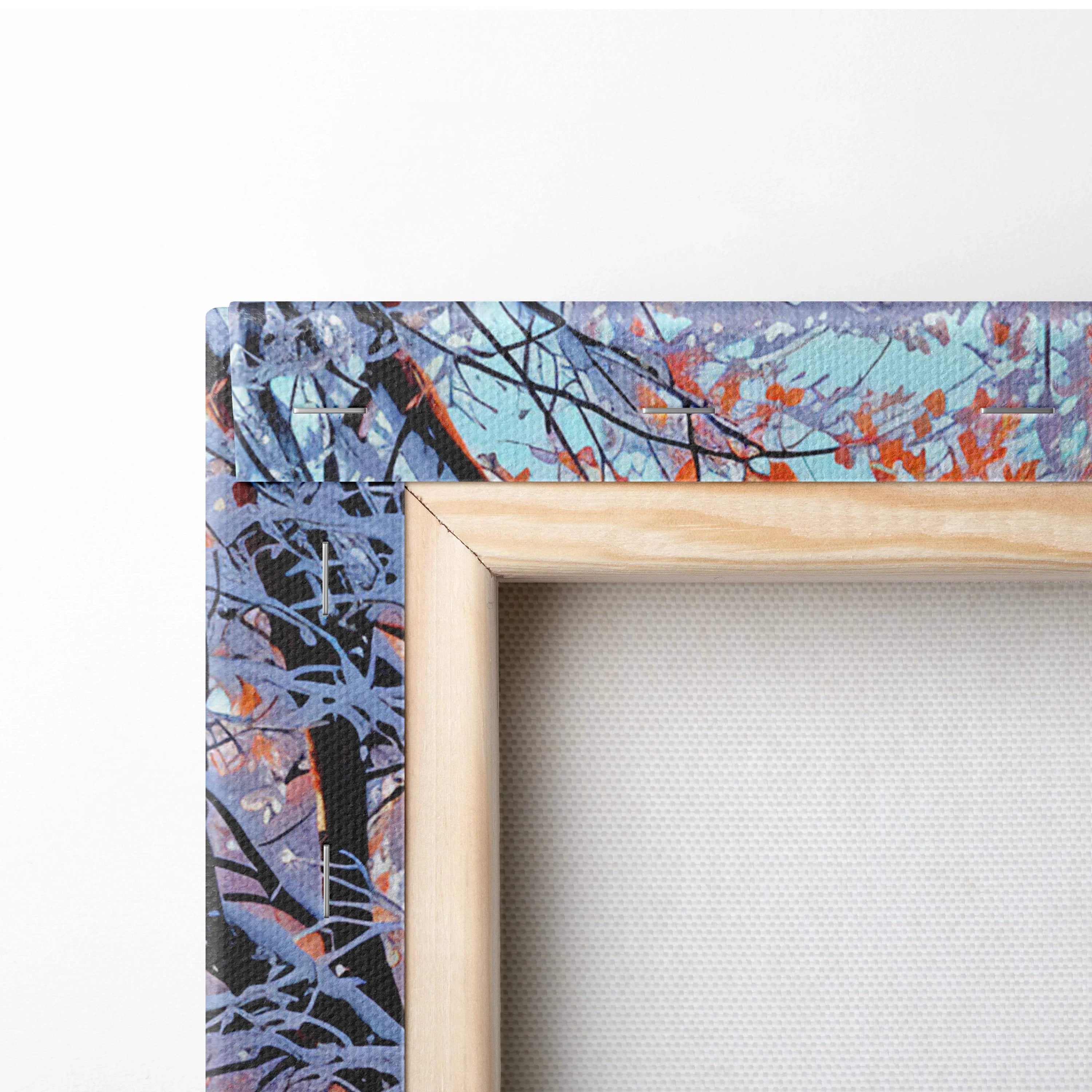 Light wood-framed canvas of autumn leaves in orange purple on teal sky