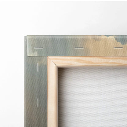 Back of Heavenly Cloudscape canvas art with light wood frame, muted green textured backing, subtle stitching