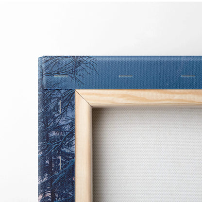 Light wood-framed Dreamlike Winter Deer canvas with dark blue tree-branch edge