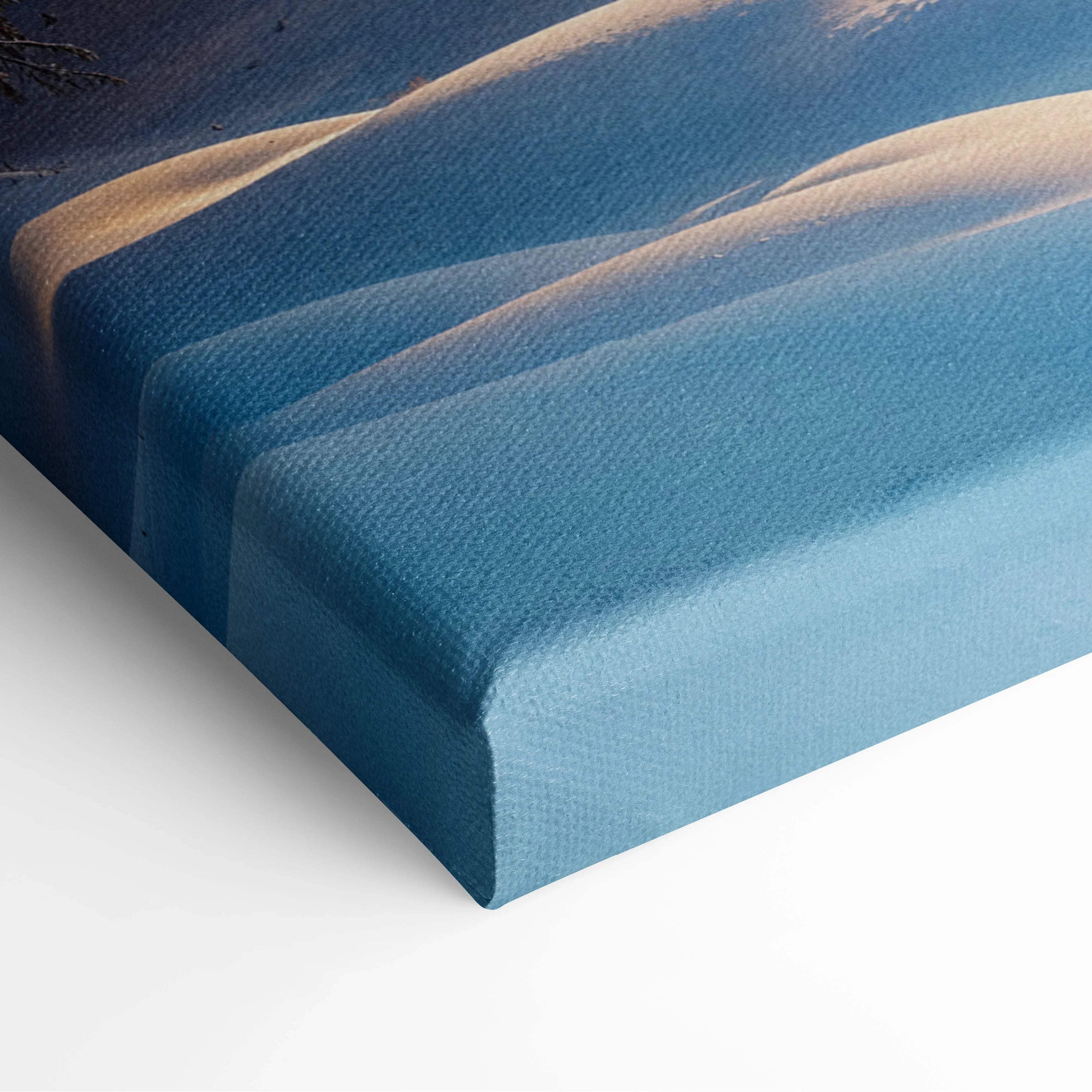 Blue textured canvas print of cozy snowy cabin with deer in sunlit forest