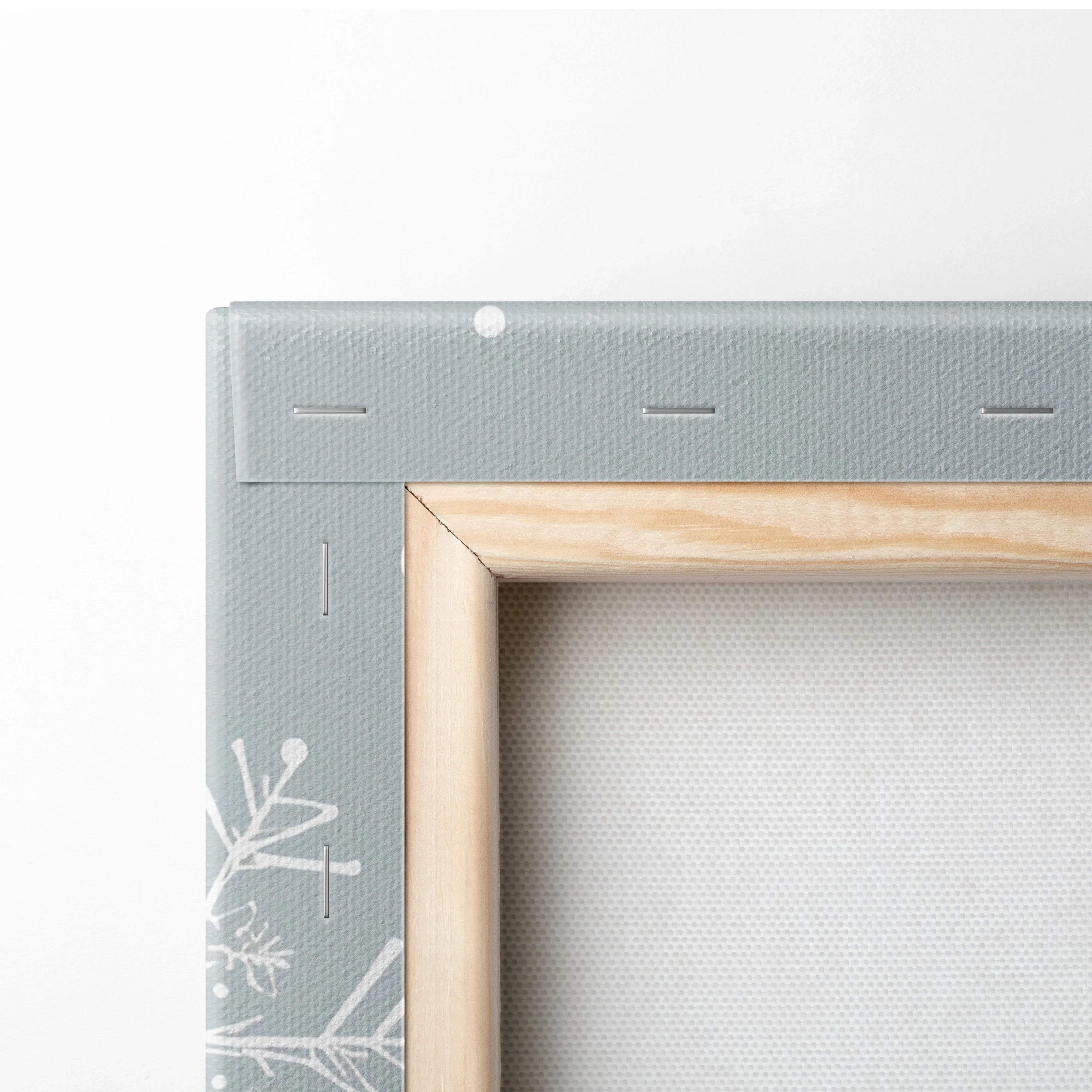 Whimsical winter village canvas art in pastel blues with gray frame and wood border