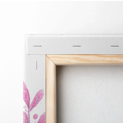Minimalist wooden-framed canvas back with pink botanical corner design