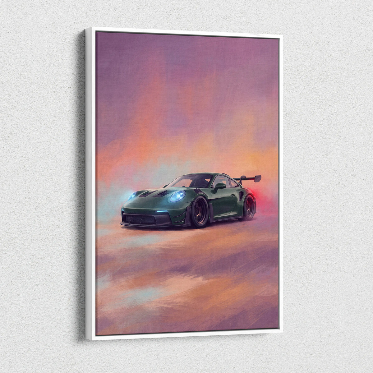 A framed canvas print of a dark green porsche 911 gt3 rs with glowing headlights set against a sunset sky