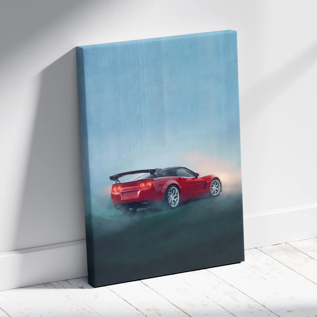 Red chevrolet corvette canvas print featuring a sporty car in motion on a misty blue background for living room wall art