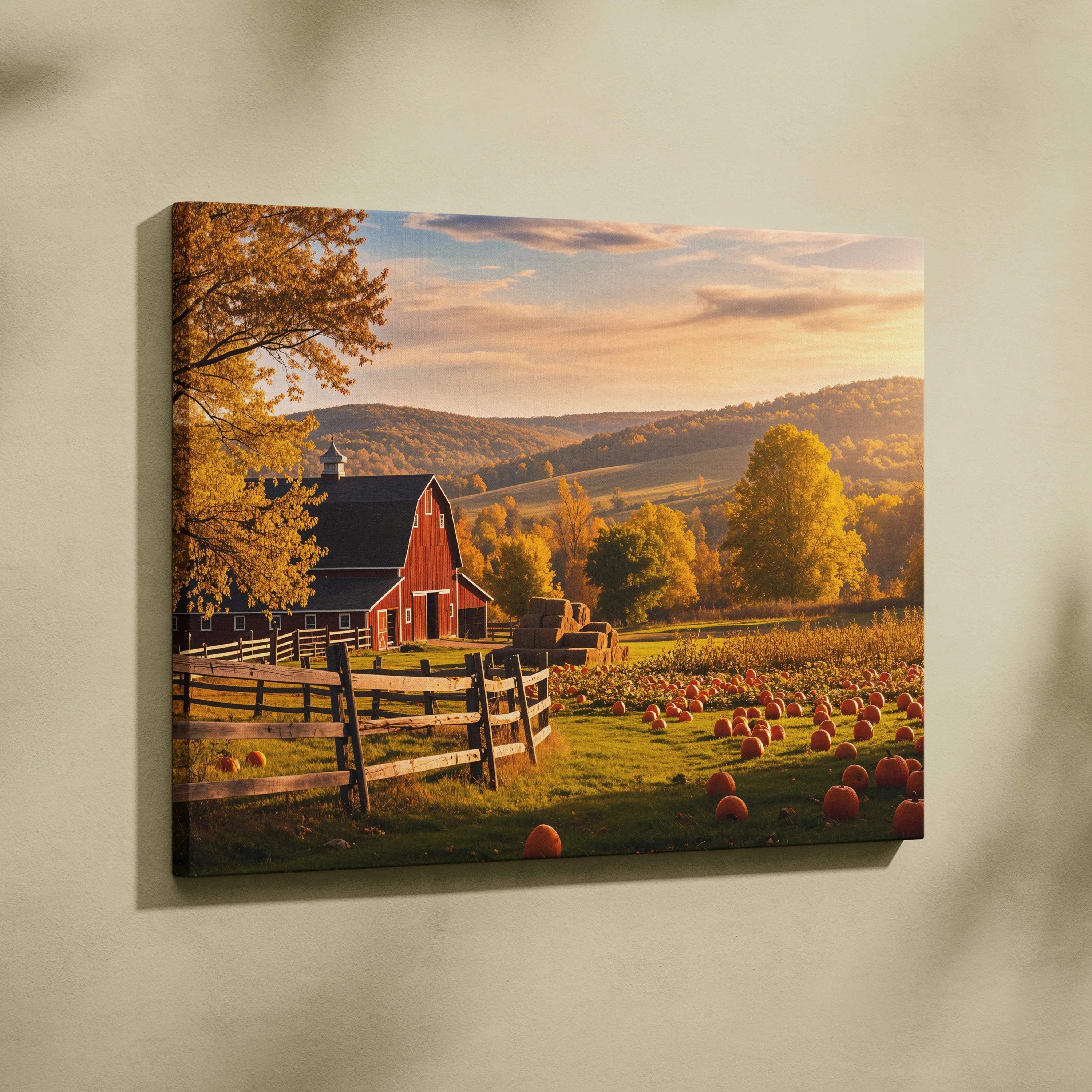 Rustic red barn canvas print with golden autumn foliage, pumpkins and hay bales under sunset sky
