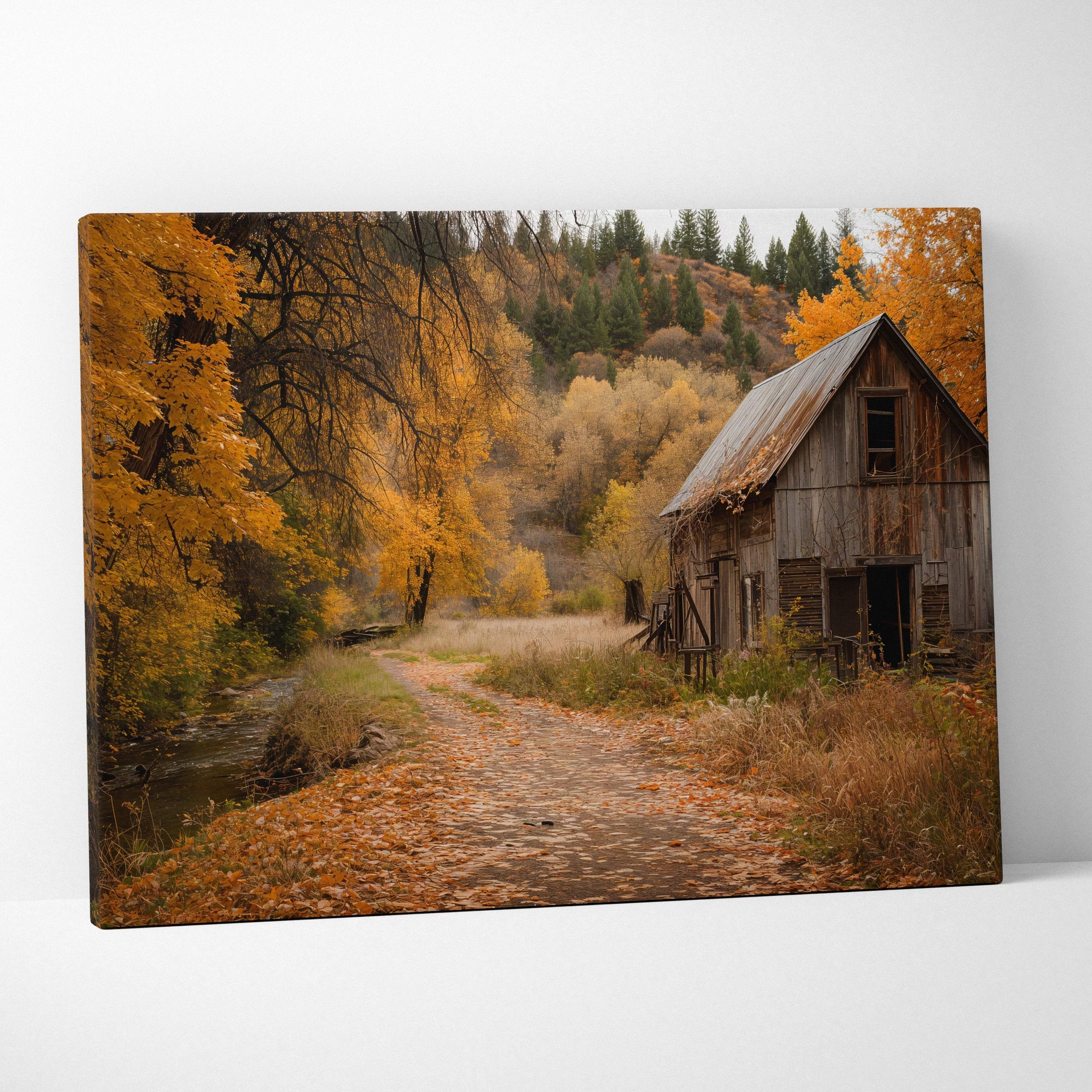 Rustic barn with rust-streaked roof along autumn leafy path canvas art