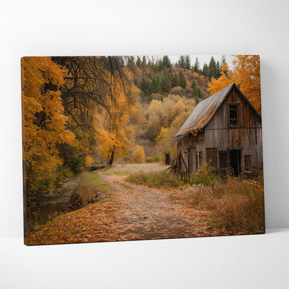 Rustic barn with rust-streaked roof along autumn leafy path canvas art