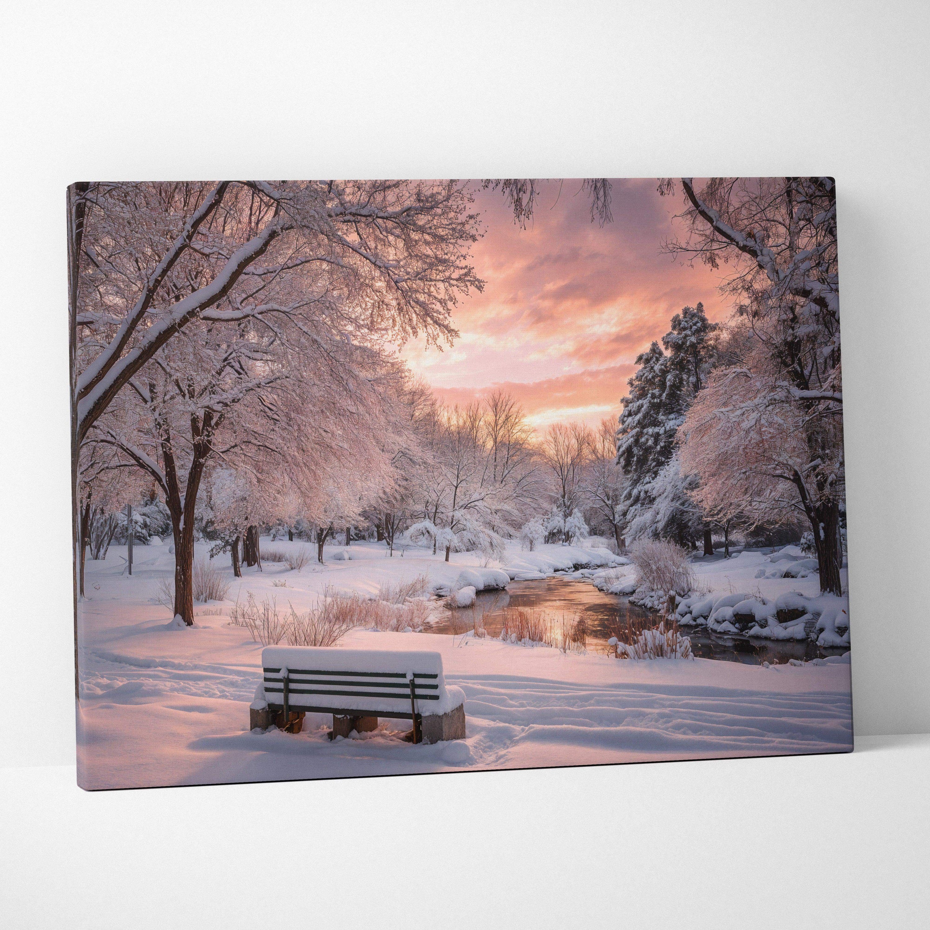 Snowy park bench by stream at dusk with warm sunset light canvas art