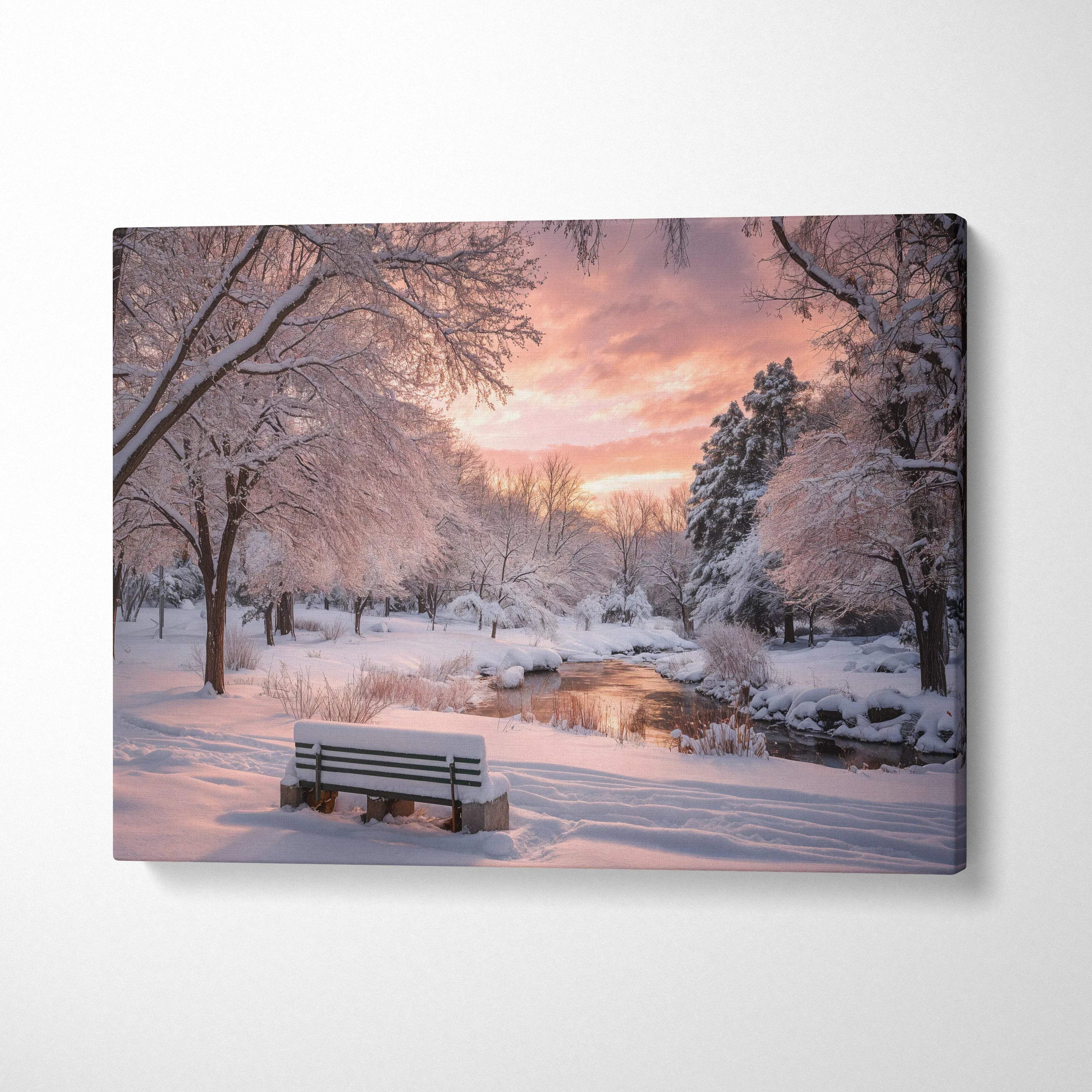 Snowy park bench by stream at dusk with warm sunset light canvas art