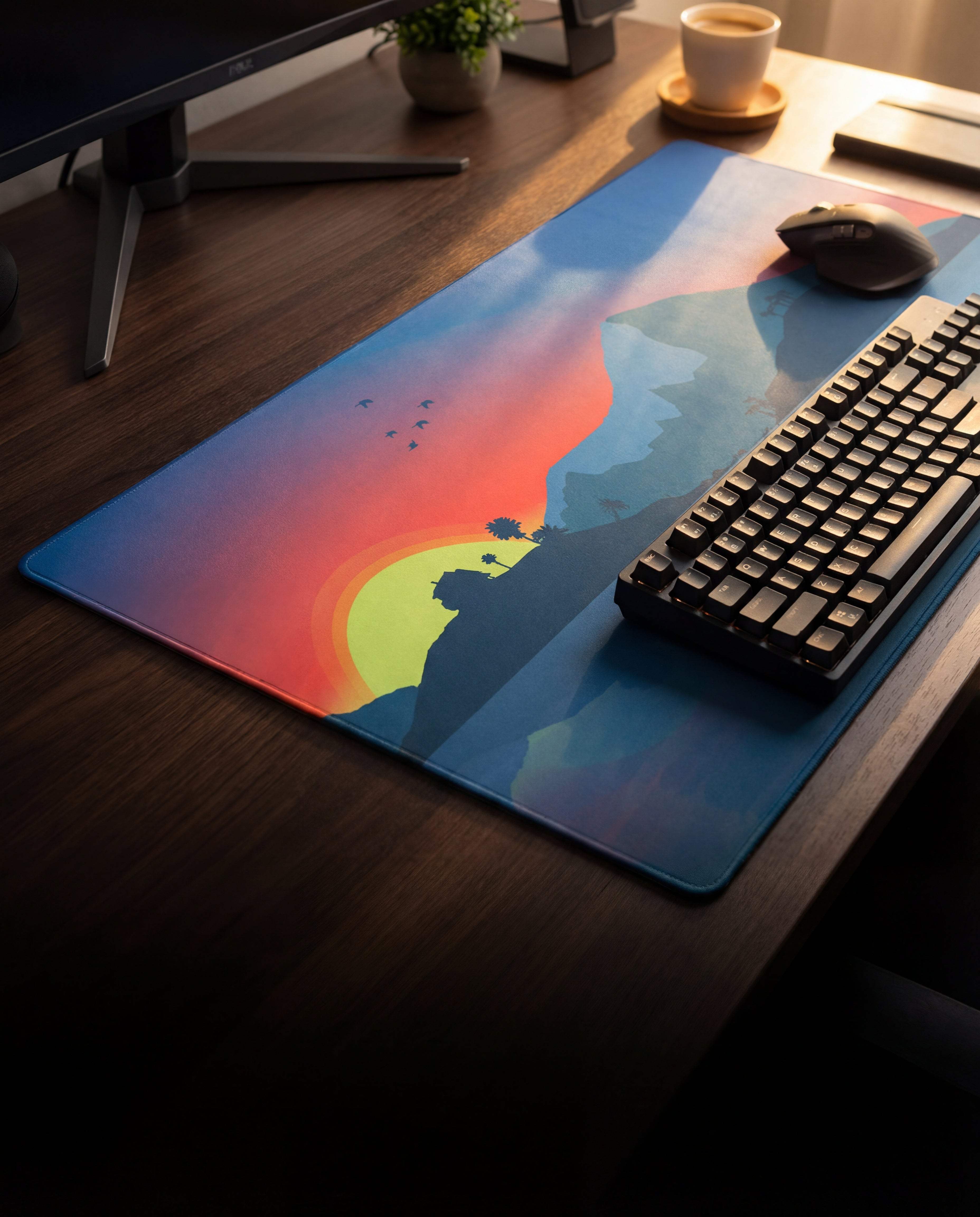 A vibrant, rectangular gaming mousepad featuring a stylized sunset over mountains with silhouetted trees and birds in flight.