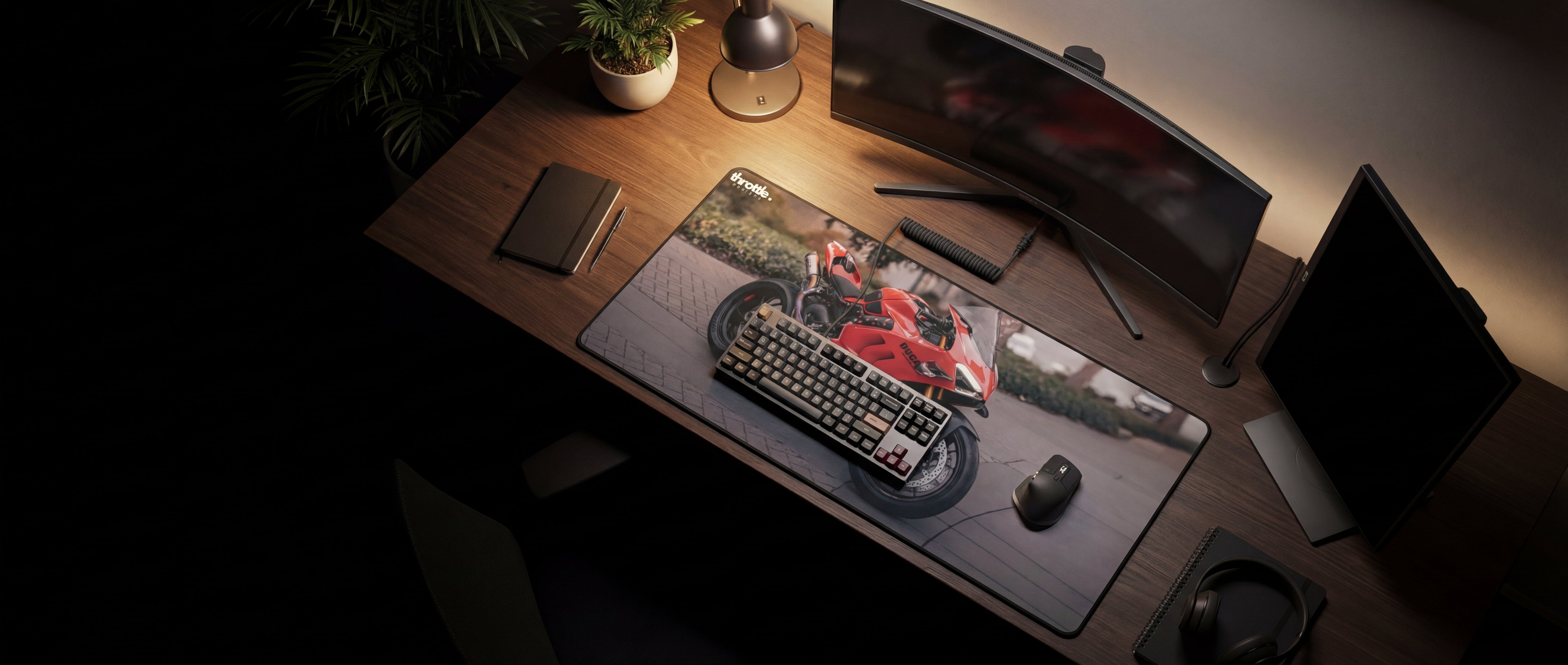 Red motorcycle graphic printed on a black gaming mousepad.