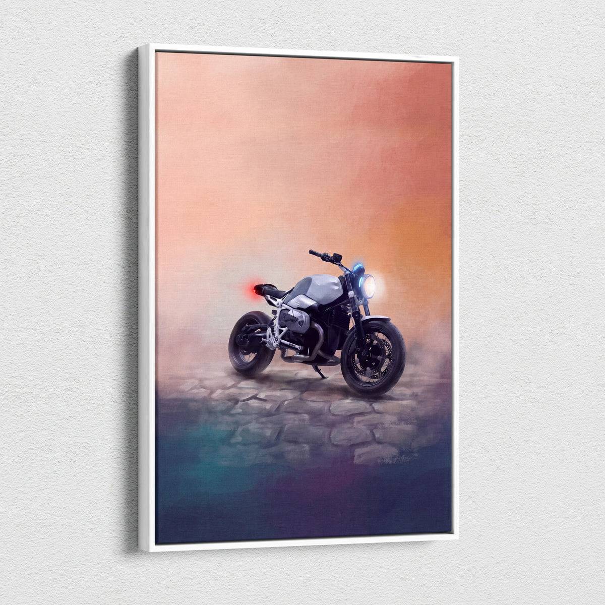 A framed canvas print of a matte black and silver BMW R nineT inspired motorcycle with glowing headlights and gradient sky