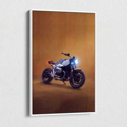 A sleek silver and black BMW R nineT inspired motorcycle canvas print with glowing headlights and warm amber backdrop