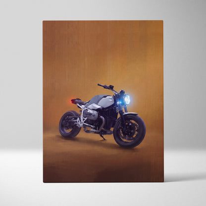 A sleek silver and black bmw r1200gs motorcycle wall art with glowing headlight in an artistic studio setting