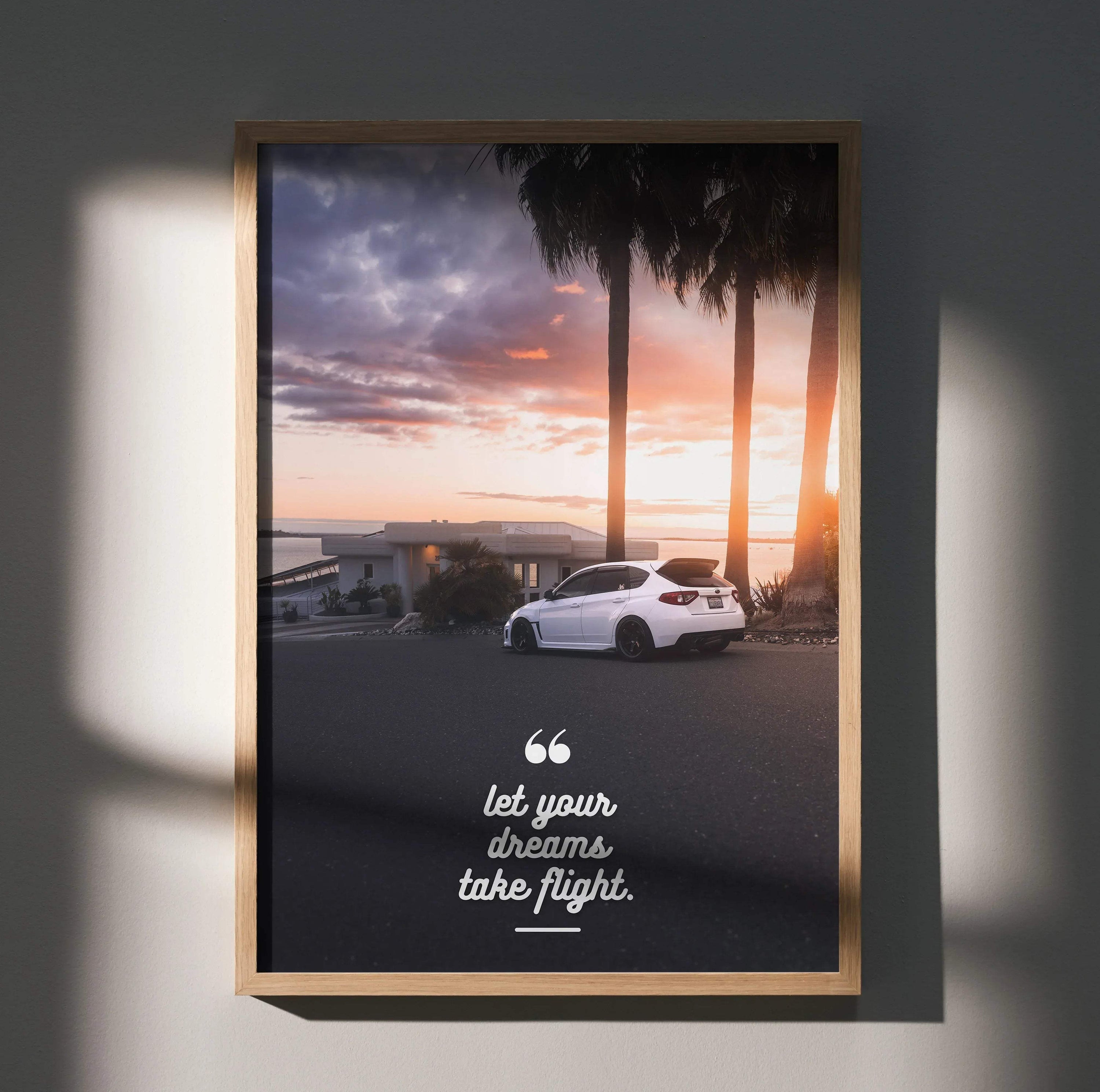 Motivational poster wall art with white Subaru WRX STI at sunset and inspiring "Let your dreams take flight" quote.