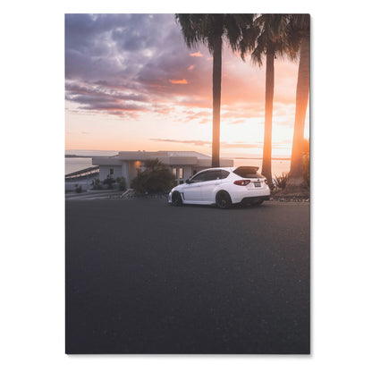 White Subaru WRX STI parked by palm trees at sunset, vibrant colors poster wall art.