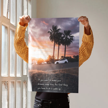 Motivational poster wall art featuring a white Subaru WRX STI at sunset with palm trees and inspiring text.