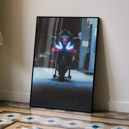 Aprilia RSV4 1100 Factory motorcycle close-up poster wall art with black frame leaning on floor.