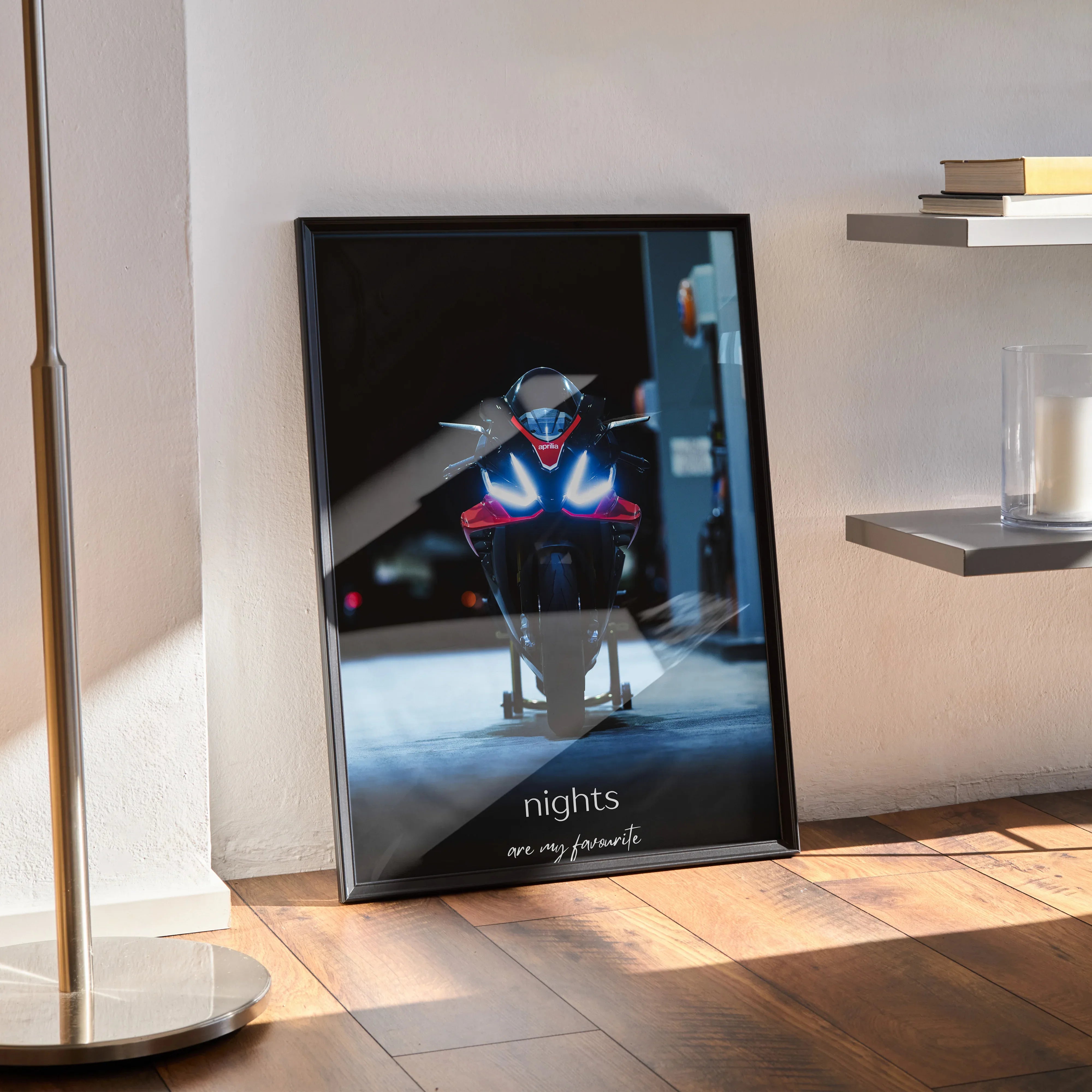 Framed Aprilia RSV4 1100 Factory motorcycle poster with "nights are my friends" text leaning against wall wall art.