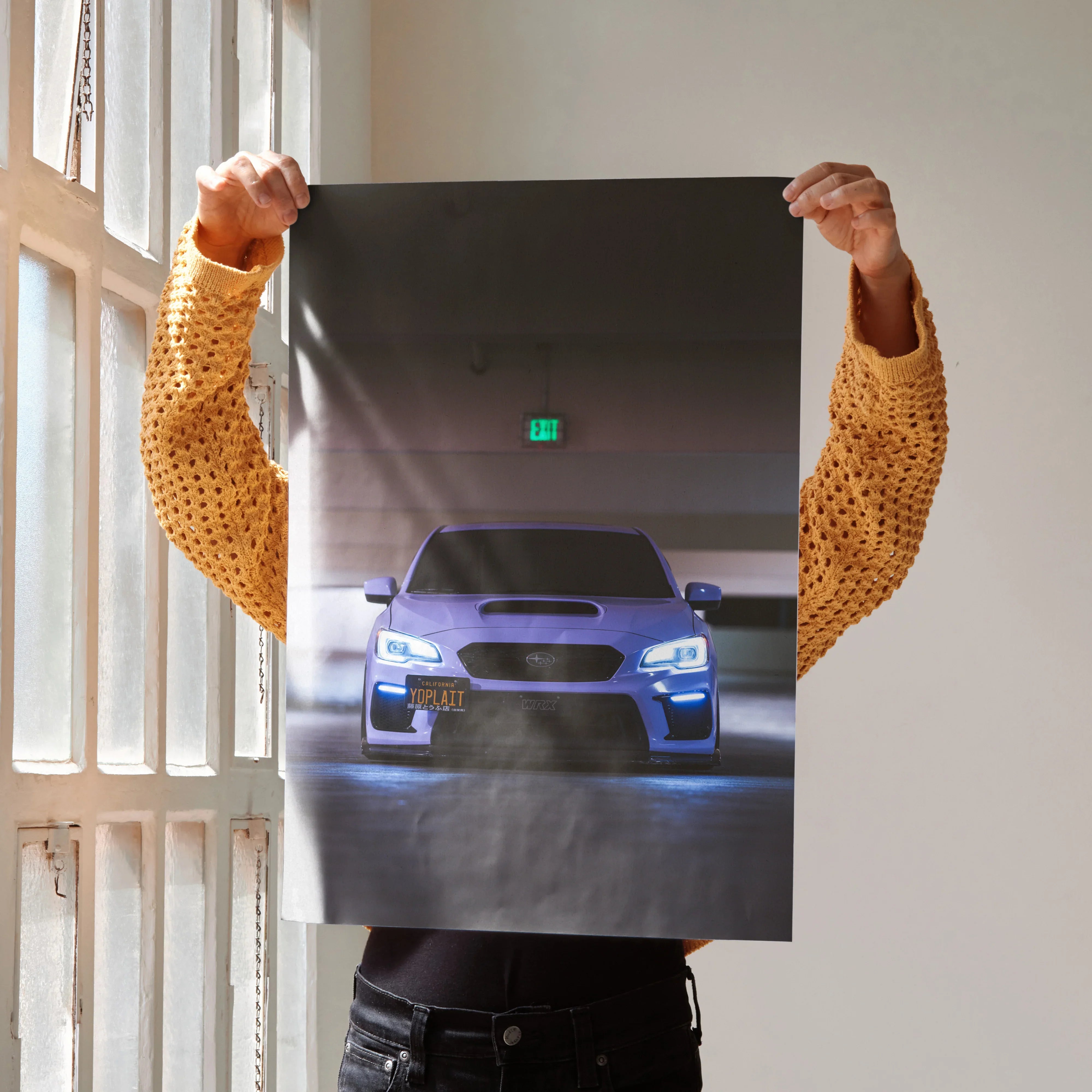 Blue Subaru WRX featured on poster wall art with dramatic shadow and light effects.