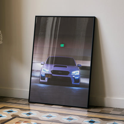 Subaru WRX front view poster with headlights on, displayed as wall art in black frame.