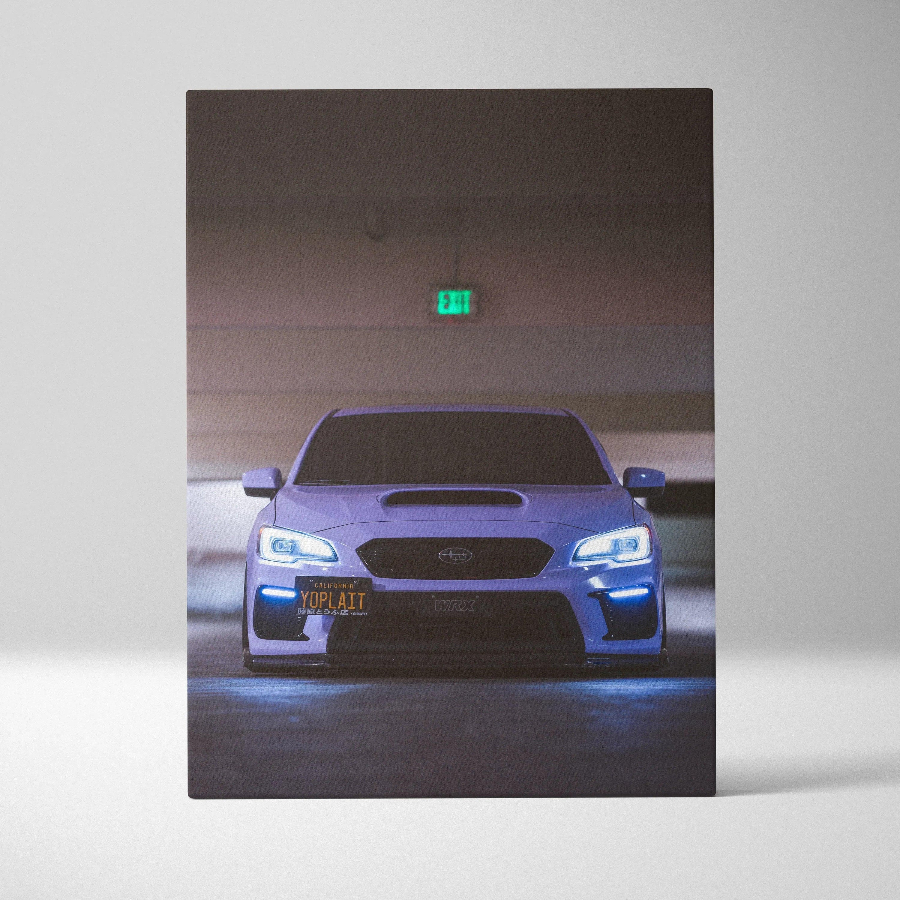 Subaru WRX front view canvas art with glowing headlights and dark background wall art.