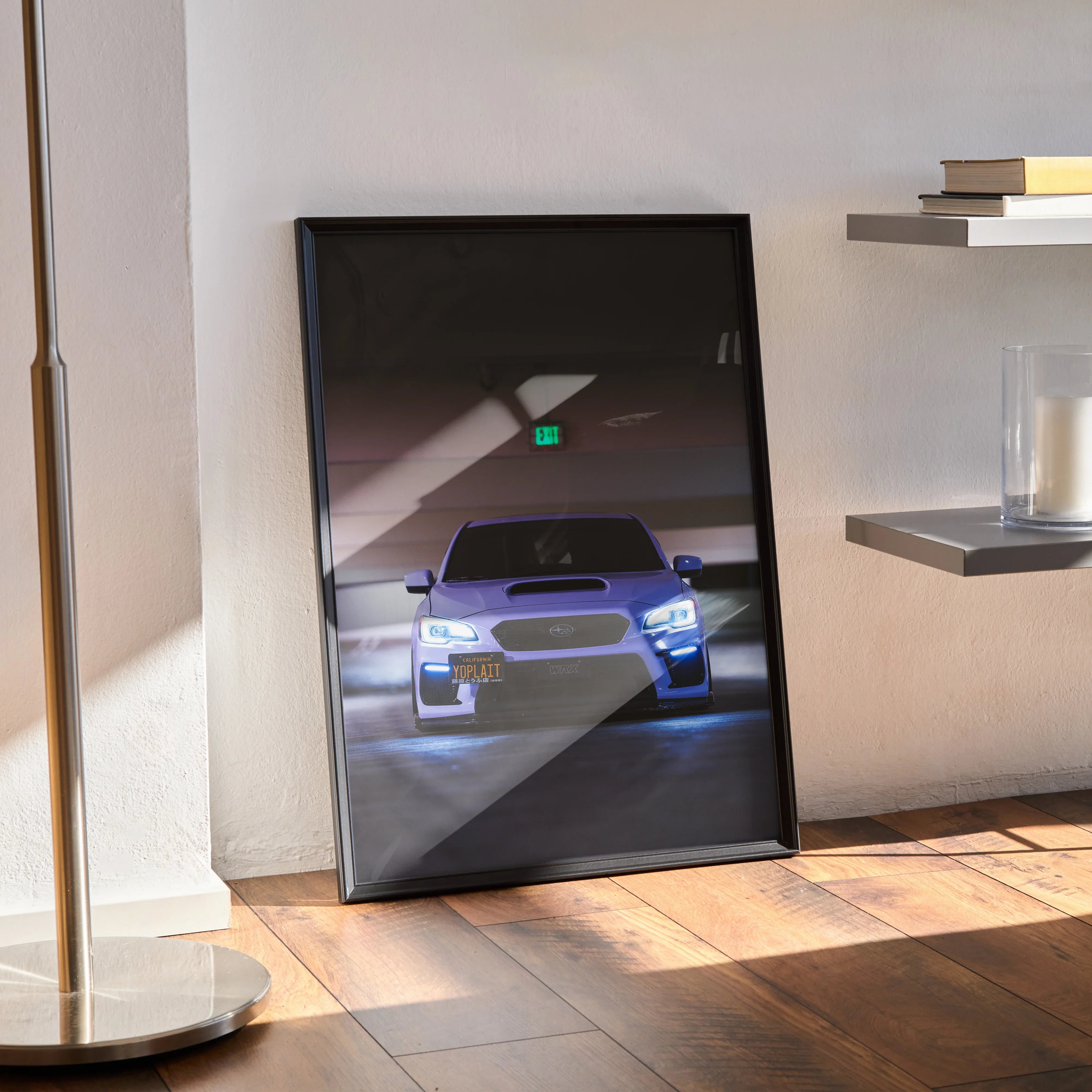 Framed Subaru WRX poster with illuminated headlights in dark setting, modern wall art display.