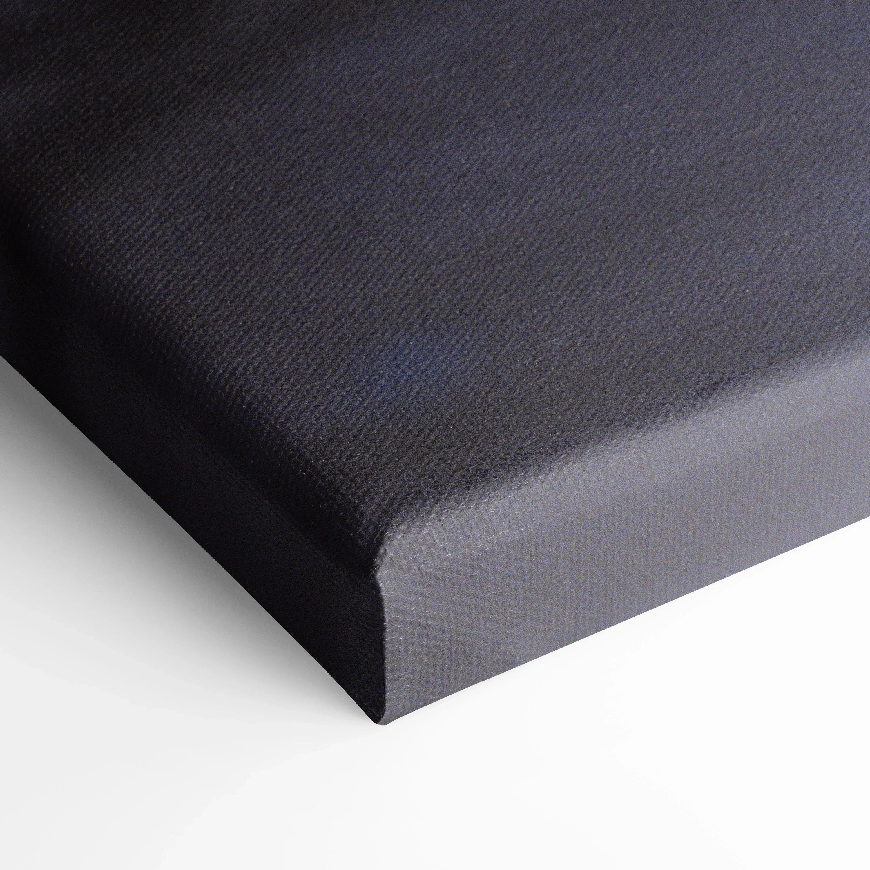 Black gallery-wrapped canvas wall art with textured surface and sharp corner edges.