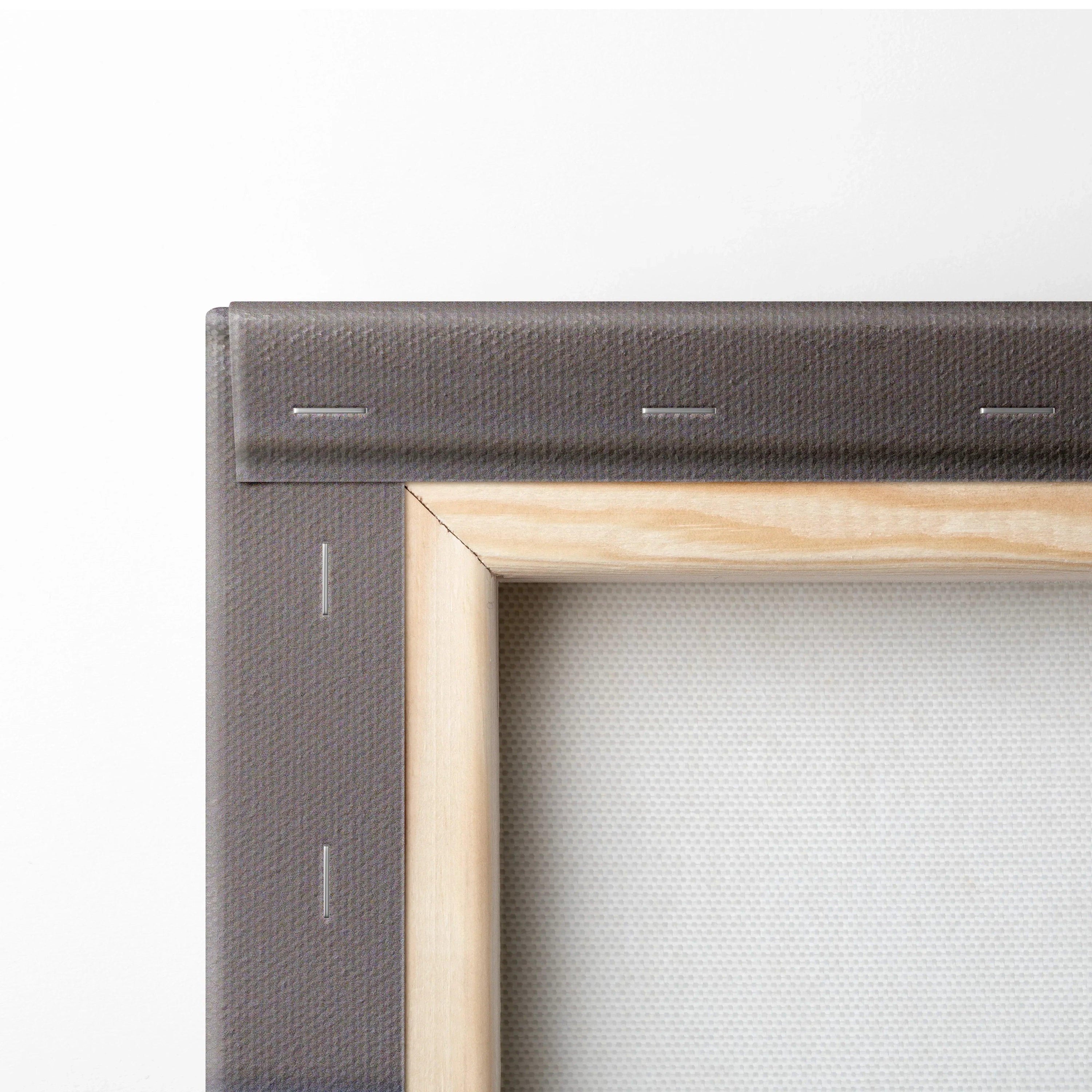 Close-up of wooden framed canvas corner with gray fabric backing and stapled edges for wall art canvas print.
