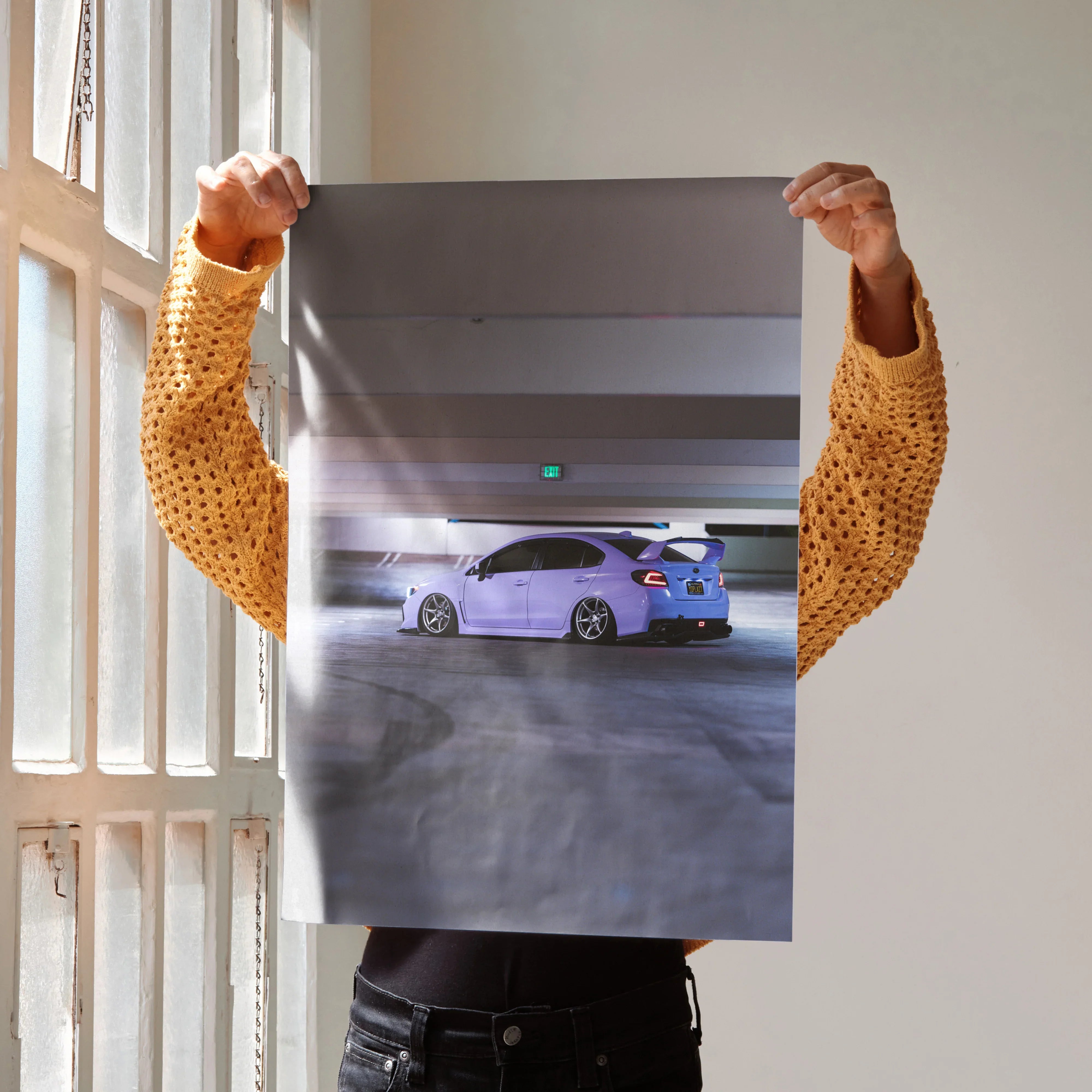 Subaru WRX in purple parked in garage with spoiler featured on poster wall art.