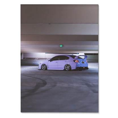 Subaru WRX in white with rear spoiler in dimly lit parking garage poster wall art.