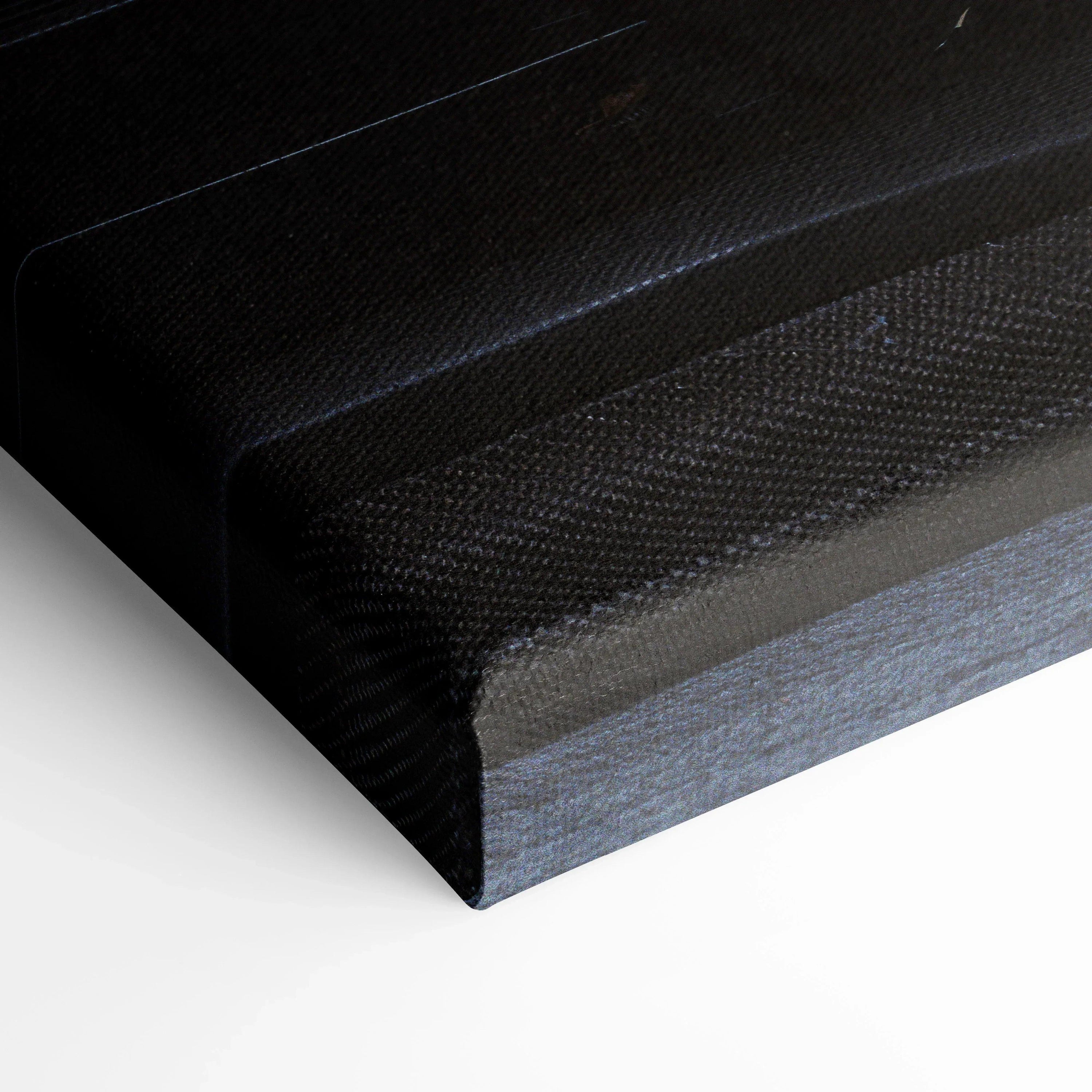 Close-up of black textured canvas edge for wall art showing museum-quality canvas art material and premium finish.