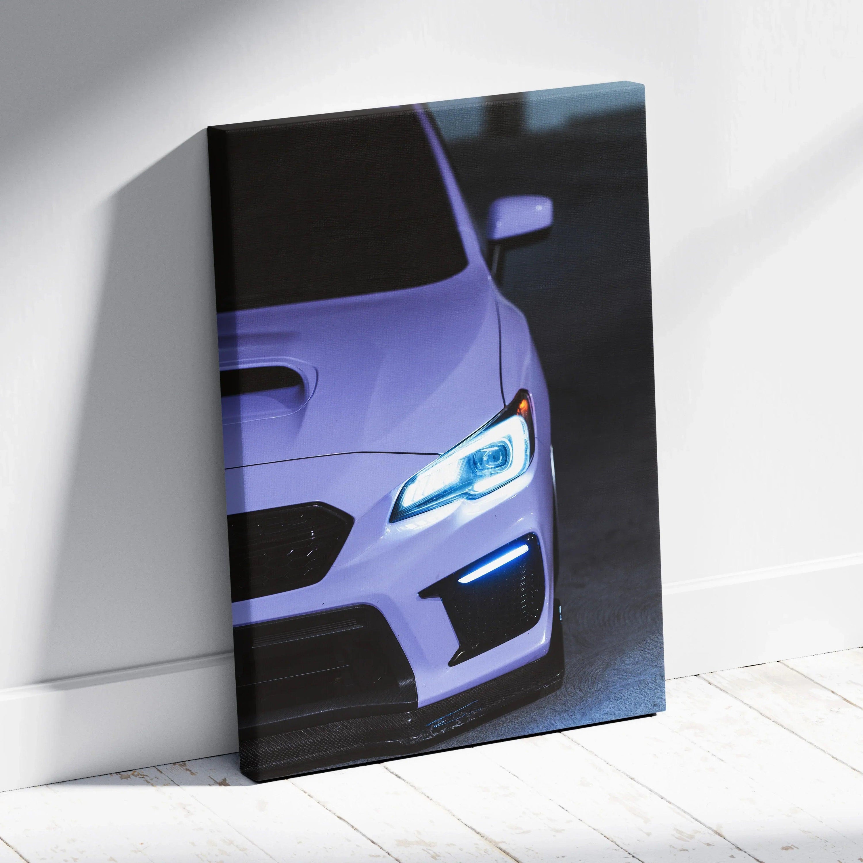 Subaru WRX close-up with illuminated headlights on vertical canvas wall art.