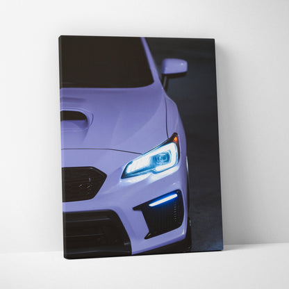 Subaru WRX close-up front view with illuminated headlights on vertical canvas wall art.