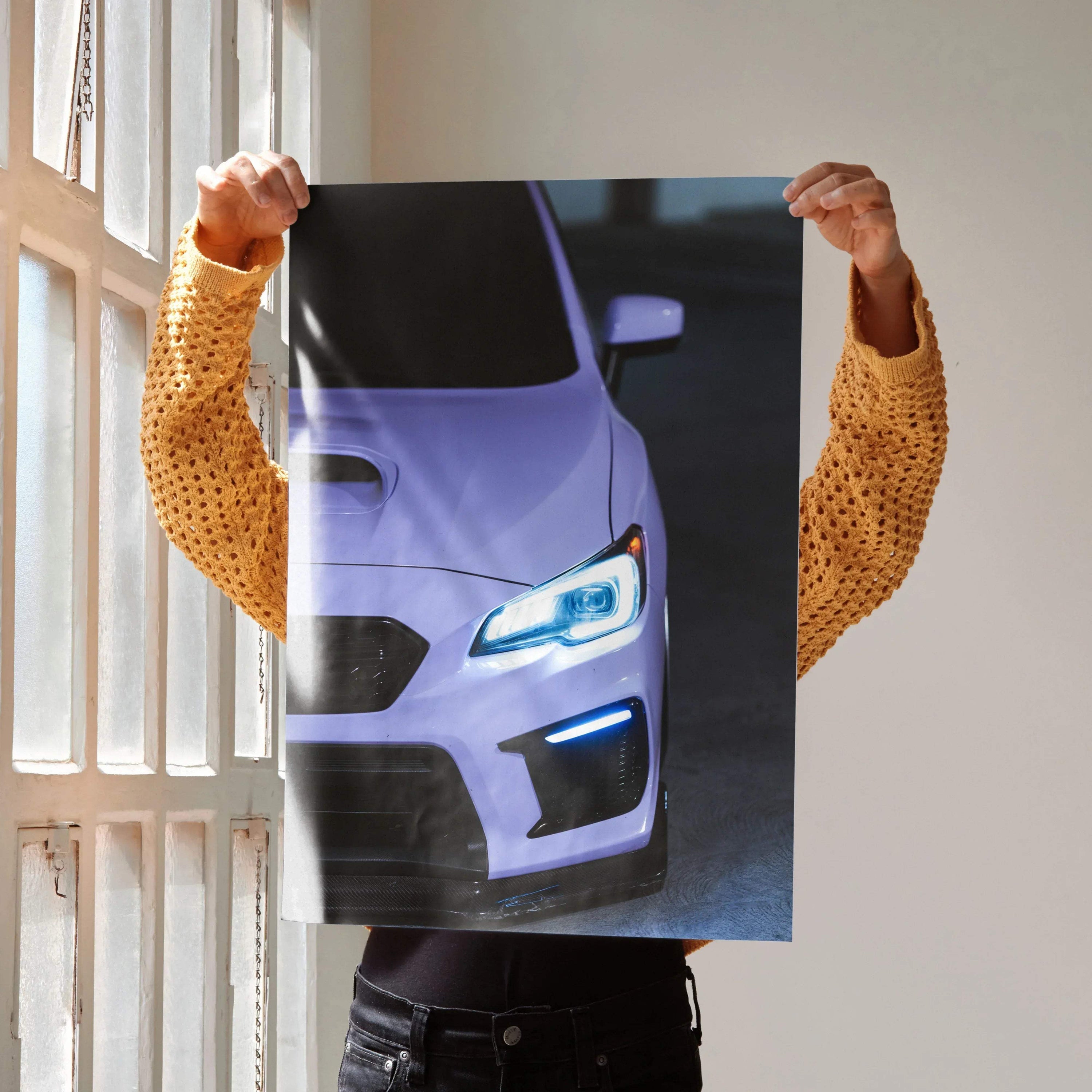 Subaru WRX front view poster wall art with illuminated headlights in dark setting.