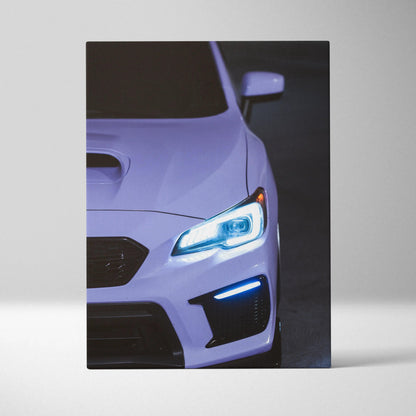 Subaru WRX front close-up with blue headlights on canvas wall art vertical print.