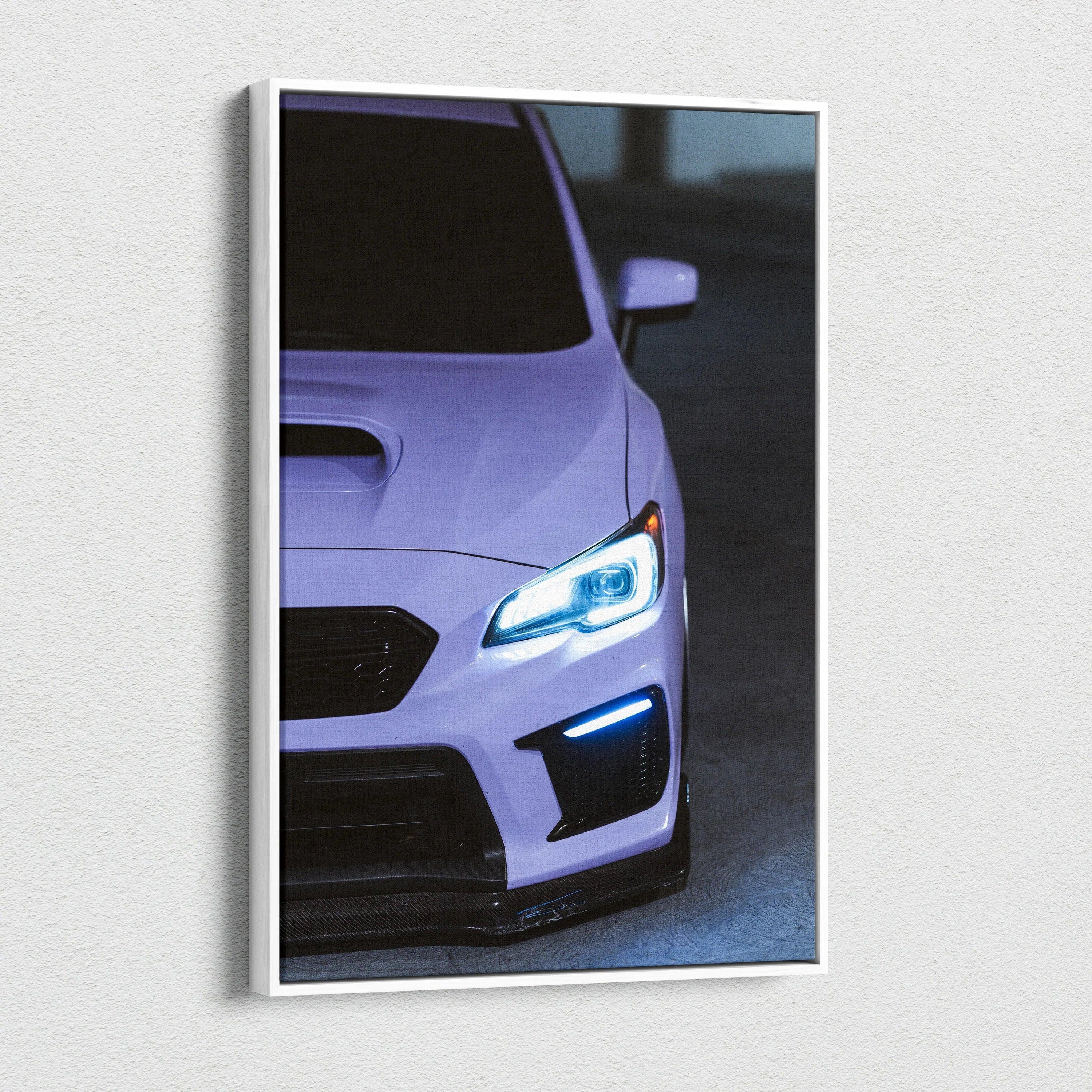 Subaru WRX front close-up with glowing headlights on vertical canvas wall art.