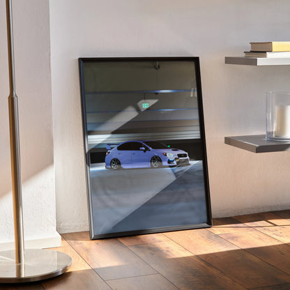 Framed Subaru WRX poster with blue sports car in dark garage, modern automotive wall art.