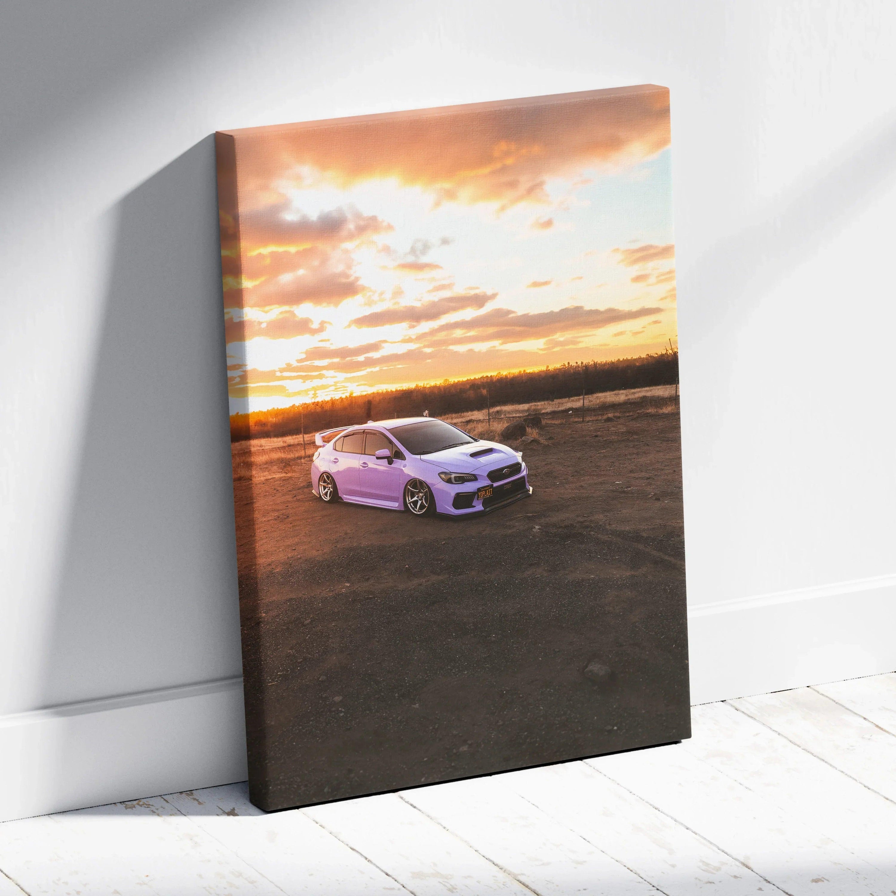 Subaru WRX car at sunset on vertical canvas wall art with vibrant sky and earth tones.