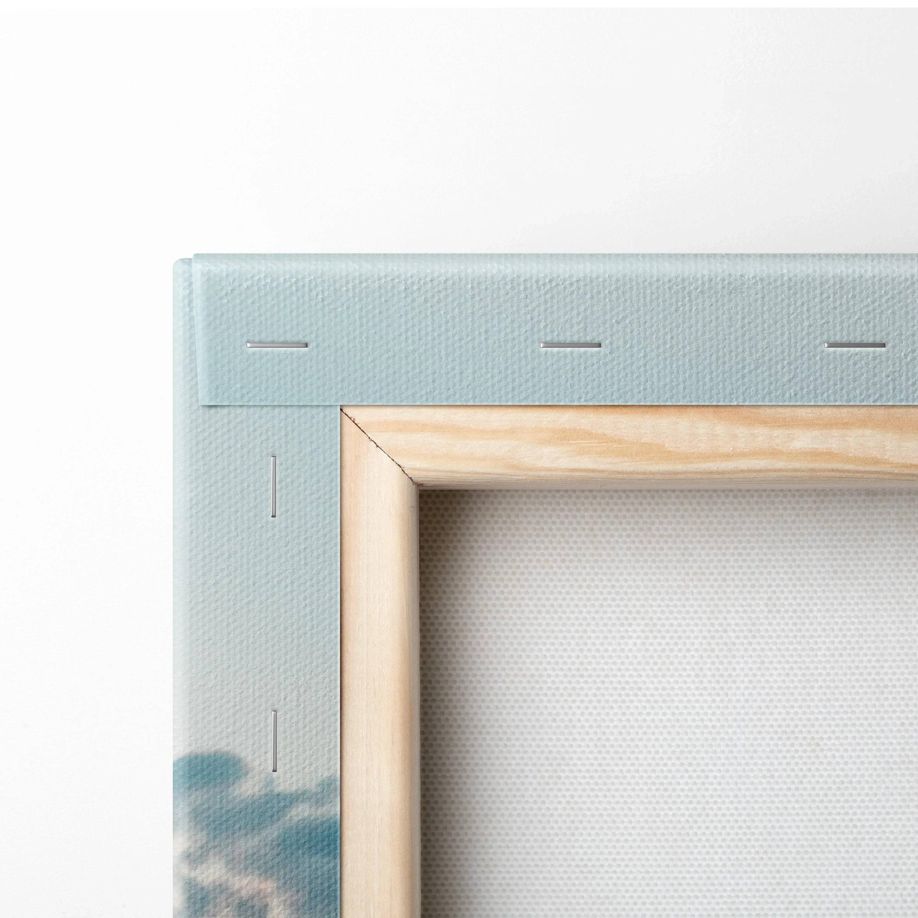 Close-up of wooden frame and blue canvas corner showing texture and staples for wall art canvas print.