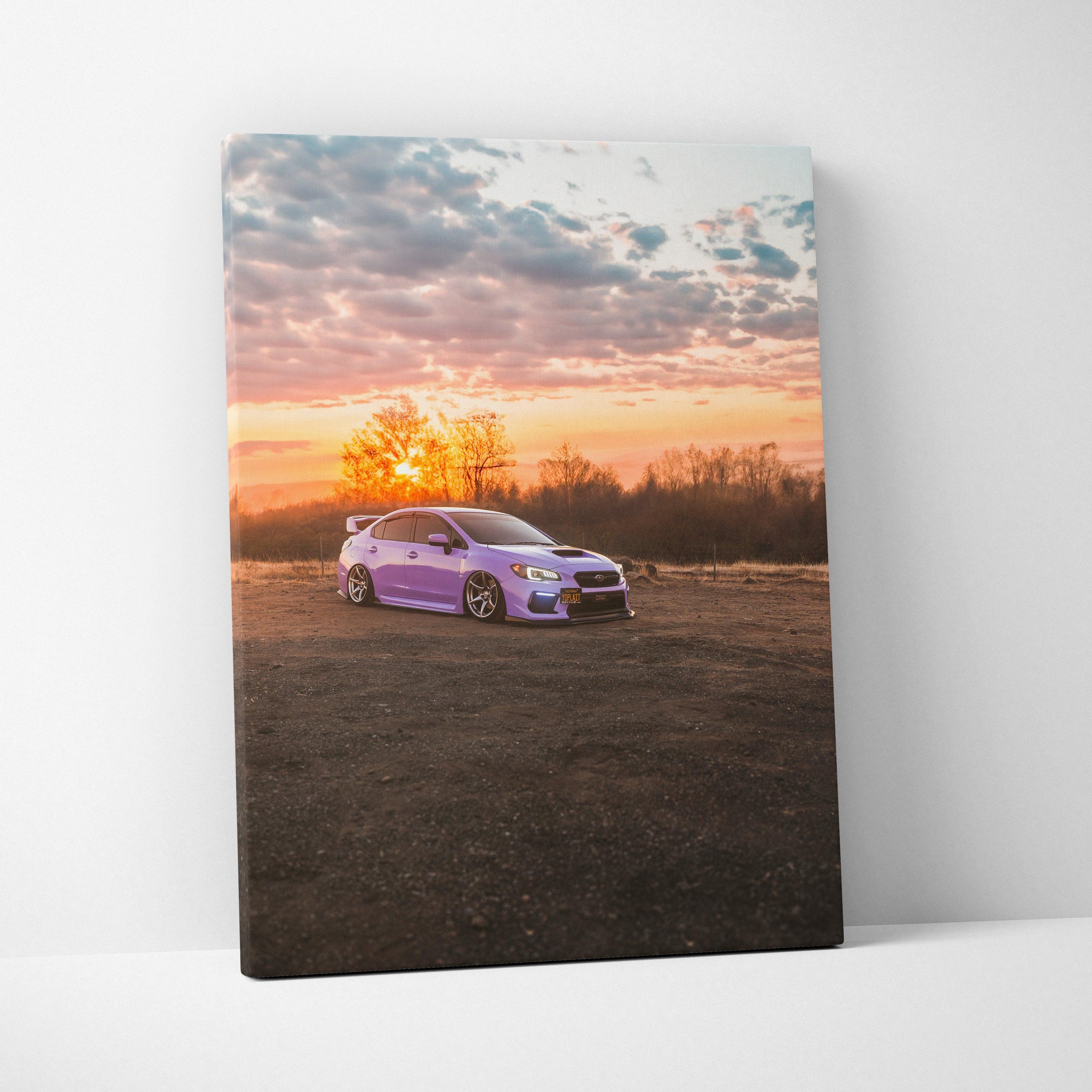 Subaru WRX purple car at sunset on canvas wall art with vibrant sky background.
