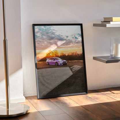 Subaru WRX parked at sunset with colorful sky poster wall art in black frame.