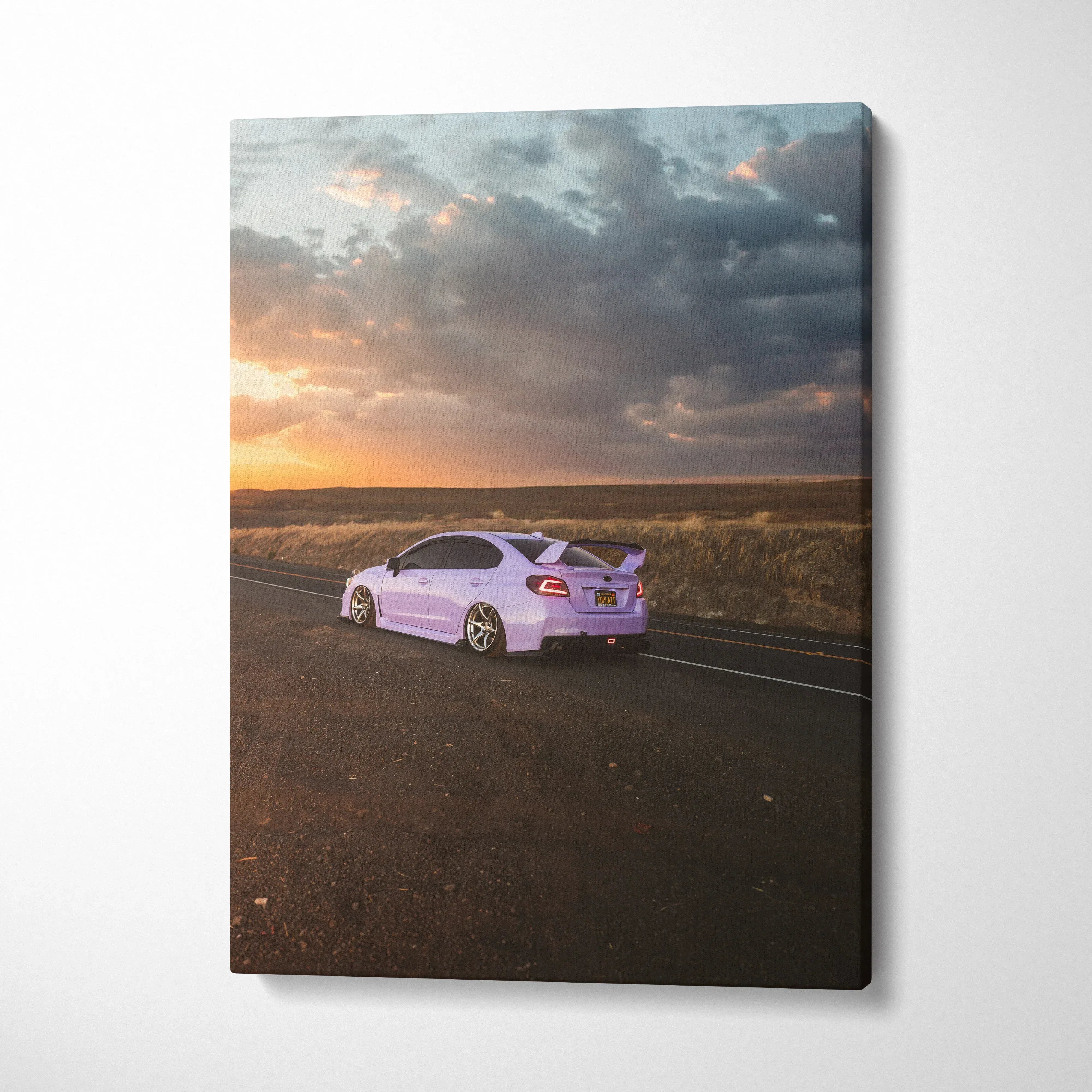 Subaru WRX on open road at sunset vertical canvas wall art with dramatic sky.