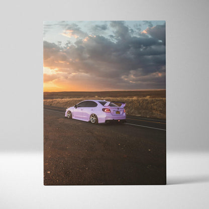 Subaru WRX sports car on road at sunset canvas wall art with dramatic sky.
